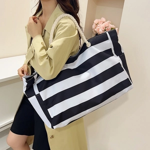 Large striped canvas tote bag with thick rope handles for beach and daily leisure