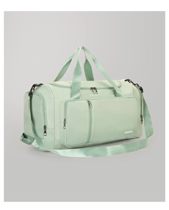 Detail view of mint green gym bag with side compartment and adjustable shoulder strap
