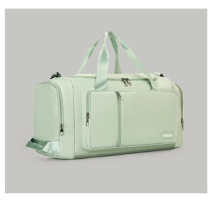 Detail of the light green fitness bag showing the side shoe compartment and nylon texture