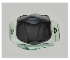 Interior view of light green fitness bag showing spacious main compartment and pockets