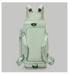 Light green sports duffel bag with dual handles and organized multiple zipper compartments