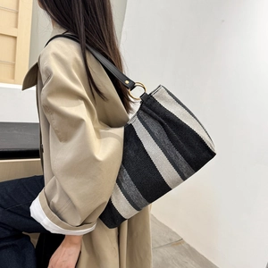Minimalist striped tote bag for women with black and grey wide stripes and leather strap