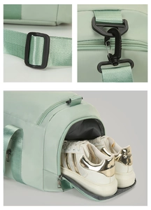 Detail view of large sports bag featuring independent shoe compartment and metal hardware