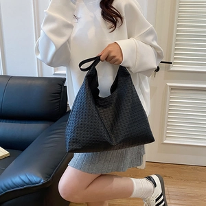 Fashionable black woven leather tote bag with large capacity for daily commuting