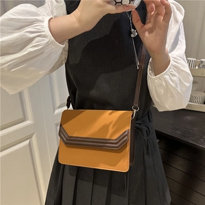 Chic mustard yellow rectangular crossbody bag with dark brown trim for women