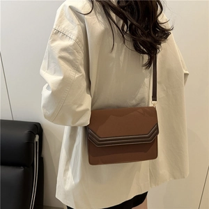 Vintage brown crossbody square bag with V-shaped patchwork and matte leather finish
