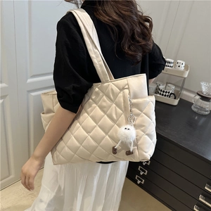 Minimalist cream large capacity quilted tote bag for women with fluffy pompom charm