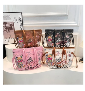 Detail view of colorful graffiti bear prints on large PU leather tote bags in four colors