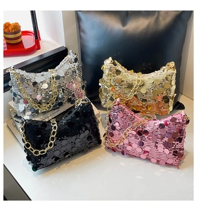 Close-up of stylish sequin crossbody bags with gold chain straps in four vibrant colors