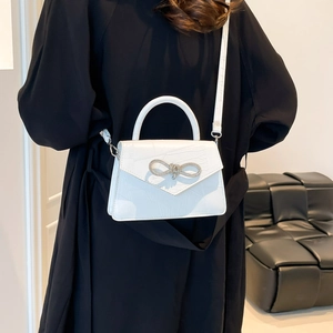 White faux-crocodile square bag with rhinestone bow detail and detachable strap