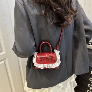 Red leather mini handbag with white lace trim and bow for elegant sweet fashion style