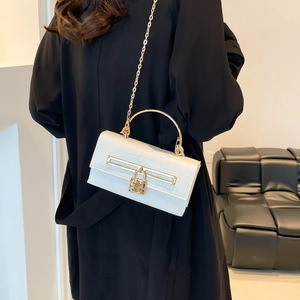 Elegant white crocodile pattern crossbody bag with gold padlock and chain strap for women