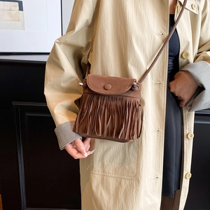 Vintage brown suede bucket bag with bohemian fringe design for women crossbody style