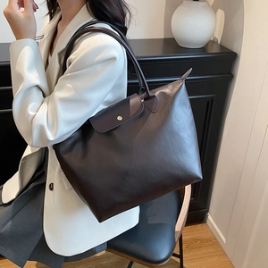 Fashionable dark brown leather tote bag with gold buckle for autumn 2025 casual wear