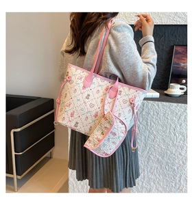 Detail of floral teddy bear tote bag with matching pouch and pink handles on model