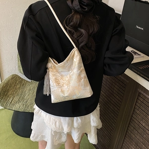 Off-white jacquard tote bag with traditional scenery patterns and white silk tassel detail