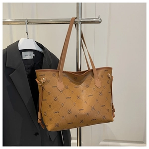 Detailed view of a brown tote bag featuring LNBOE monogram and cute rabbit print