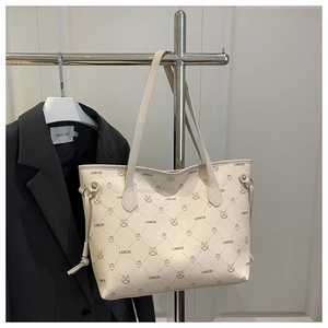 Detail of off-white tote bag with LNBOE letters and cartoon rabbit pattern print
