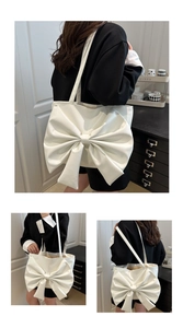 Detail of white PU tote bag featuring a large decorative bow and spacious interior
