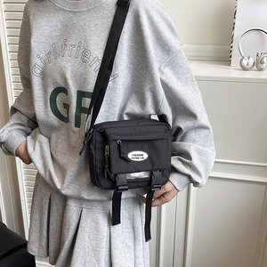 Japanese style black nylon messenger bag with fashion label and adjustable shoulder strap