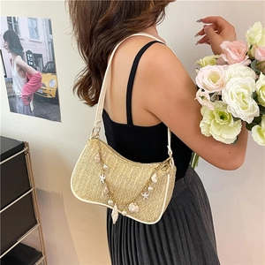 Chic beige woven underarm bag with gold chain and sea-themed charms for women