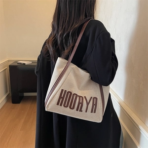 Chic beige canvas tote bag with brown leather straps and HOORYA print for daily commute