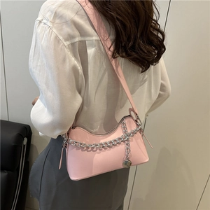 Pink PU leather crescent underarm bag with silver chain strap and metal ball charm