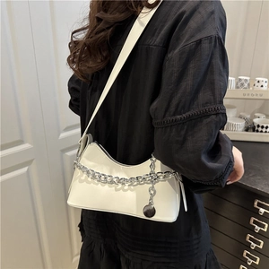 Chic white crescent shoulder bag in sleek PU leather with a chunky silver metal chain