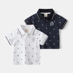 Detail of boys' polo shirts featuring nautical boat prints and embroidered crown logos