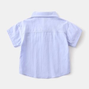 Close-up of light blue cotton shirt with clean stitching and premium texture details