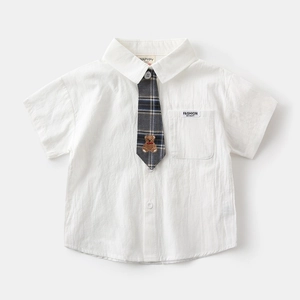 Detail of white short sleeve boy's shirt with embroidered bear plaid tie and pocket