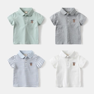 Detailed close-up of lucky bear embroidery on cotton polo shirts for boys in four colors