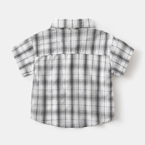 Back view of classic black and white checkered cotton shirt for boys with breathable texture