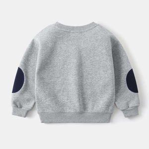 Detail view of boys' grey sweatshirt featuring vintage navy elbow patches and ribbed cuffs