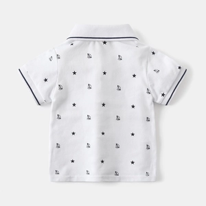 Detail of white cotton polo shirt back featuring navy star and sailboat prints