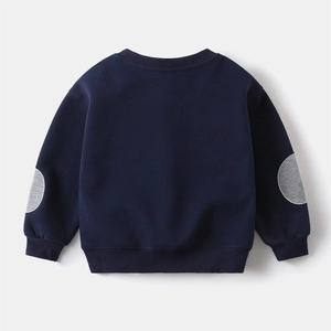 Detail view of navy blue boys sweatshirt featuring grey elbow patches and ribbed cuffs