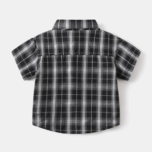Back view of classic black and white checkered cotton shirt for boys with yoke detail