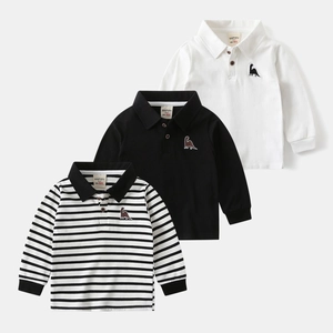 Detailed view of children's long-sleeve polo shirts with dinosaur embroidery and button collar