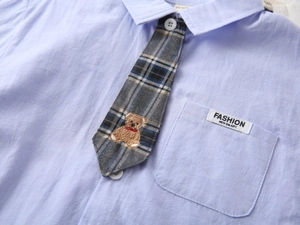 Light blue boy's short-sleeved shirt with embroidered bear plaid tie detail