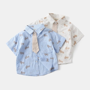 Detail of short-sleeved shirts for boys featuring pony prints and detachable ties