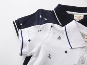 Detailed view of kids cotton pique polo shirts with star print and striped collars