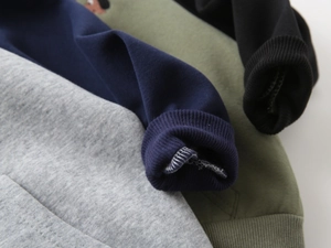 Close-up of premium ribbed cuffs in multi-color options for children hoodies
