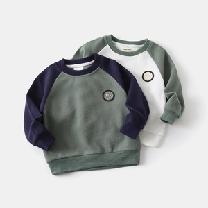 Close-up of waffle-knit texture and 'YES' patch on boys' raglan sleeve sweatshirts