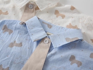 Close-up of boys' cotton shirts with pony print, textured fabric and contrast button placket