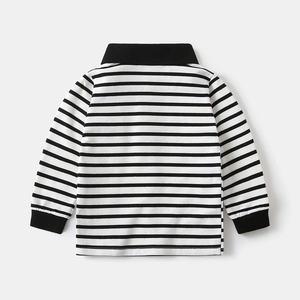 Detail of knit cotton polo shirt showing black and white stripes and ribbed collar texture