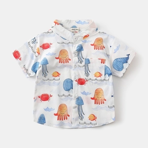 Close-up of children's white short-sleeved shirt with colorful ocean animal print details