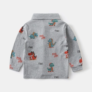 Detailed view of the soft heather gray cotton polo with colorful dinosaur prints