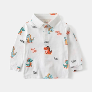 Detailed view of kids long-sleeve polo shirt with cartoon dinosaur patterns and buttons