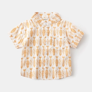 Close-up of boys' cotton shirt featuring yellow fishbone print and front chest pocket