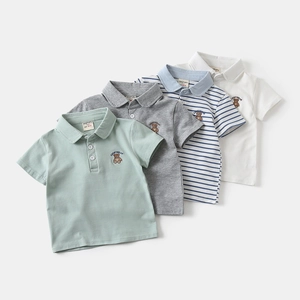 Detail of four colorful cotton polo shirts for boys featuring lucky bear embroidery